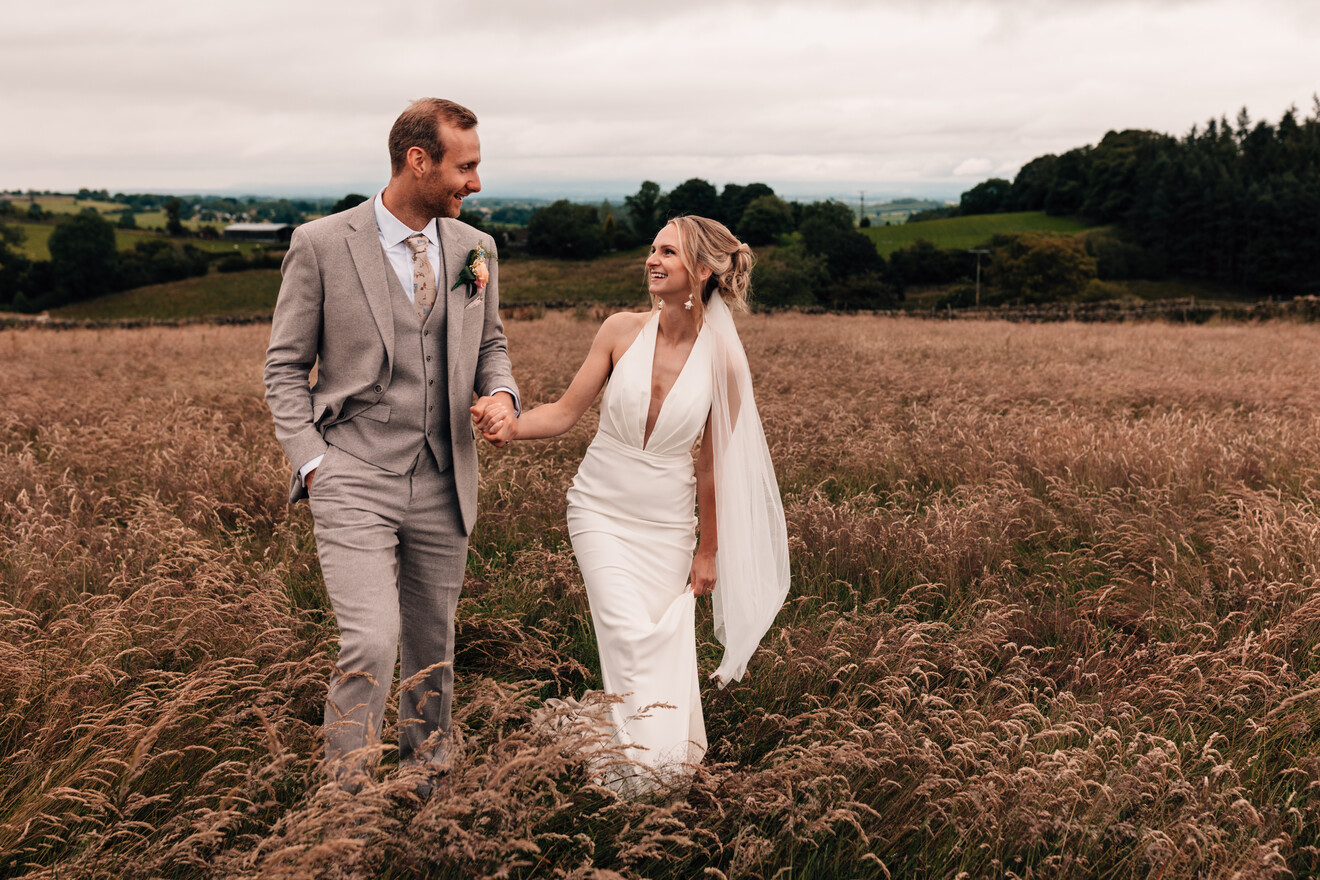 Alex and wife walking in wild field